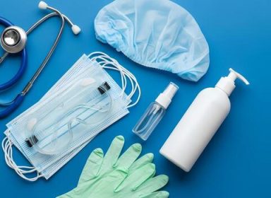 medical-supplies-flat-lay-stethoscope-face-masks-gloves-goggles-hand-sanitizer-and-cap-for-healthcare-professionals-and-pandemic-preparedness-photo